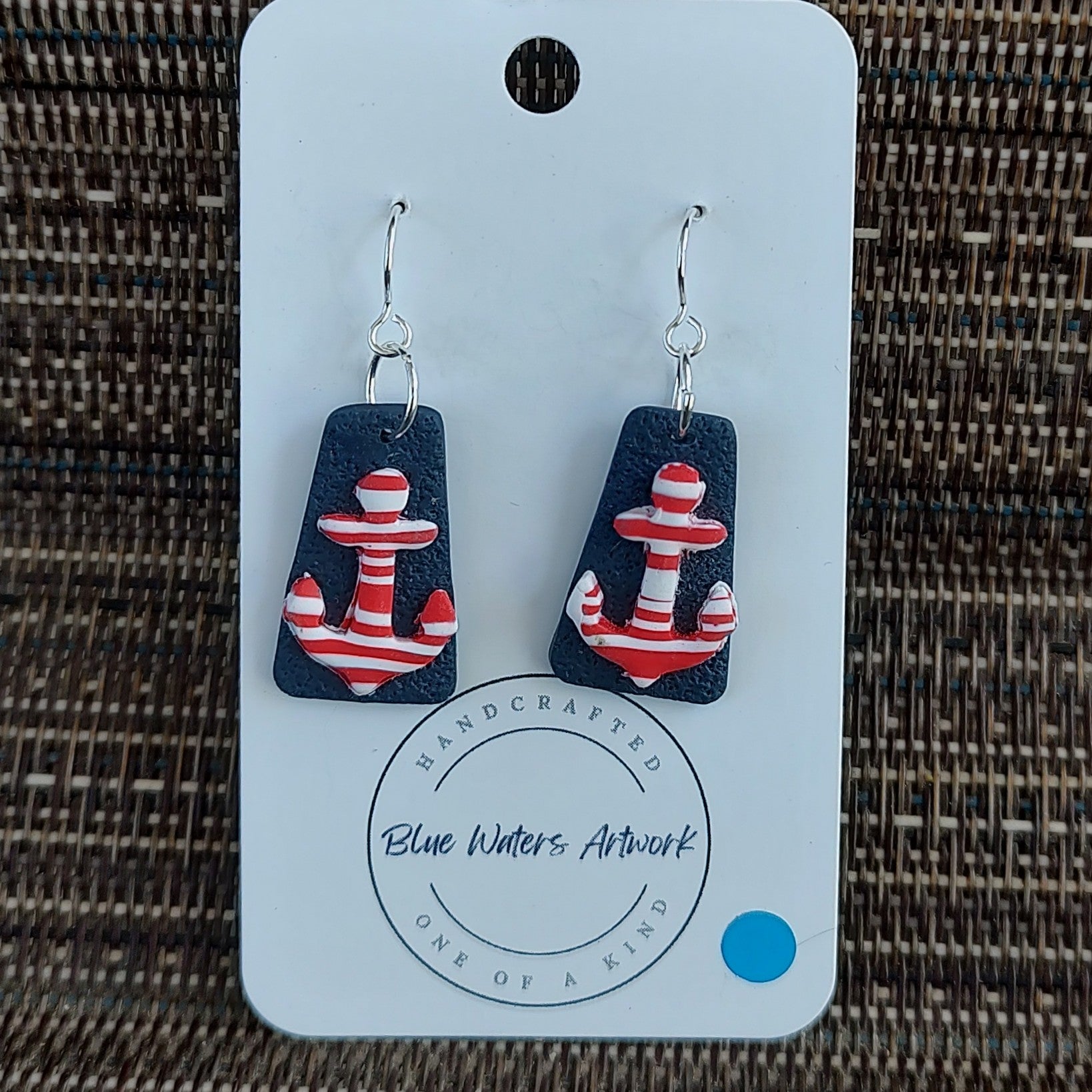 Navy blue earring with red and white stripe anchor