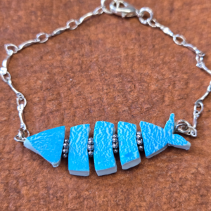 Segmented polymer clay fish bracelet. Ocean Blue